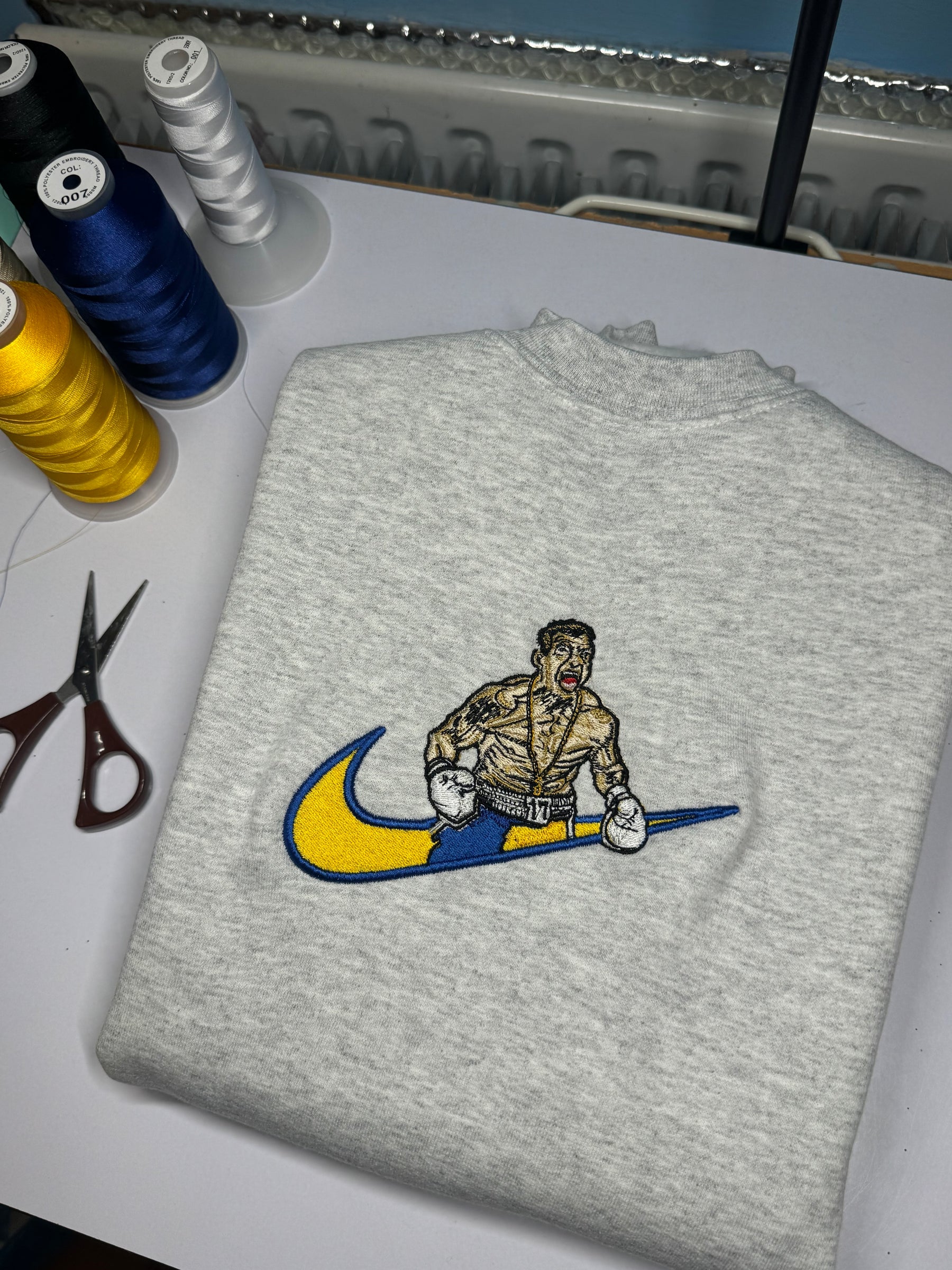 Usyk x Swoosh